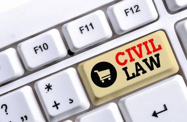 Text sign showing Civil Law. Conceptual photo Law concerned with private relations between members of community White pc keyboard with empty note paper above white background key copy space.