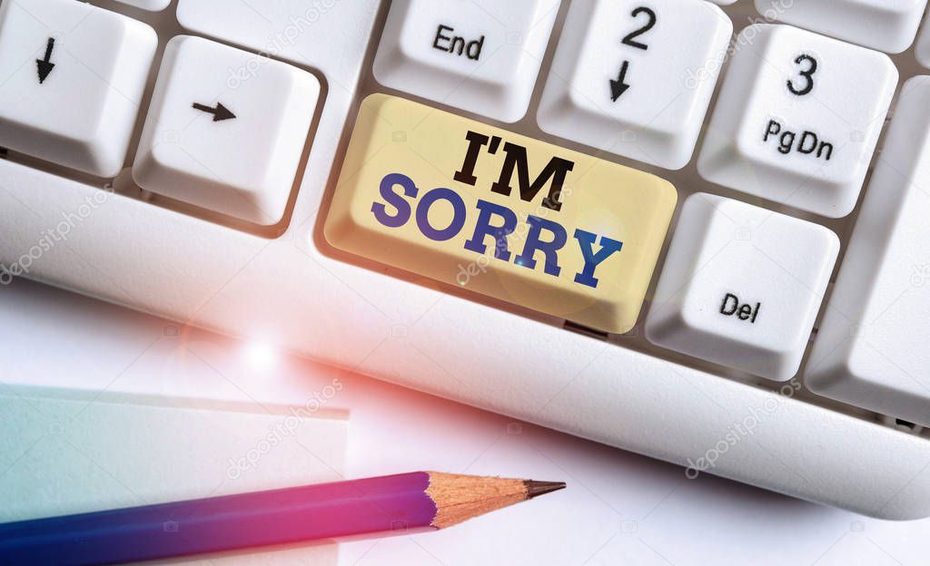 Writing note showing I M Sorry. Business photo showcasing Toask for forgiveness to someone you unintensionaly hurt White pc keyboard with note paper above the white background.