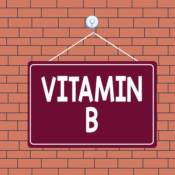Text sign showing Vitamin B. Conceptual photo Nutrient that helps keep the body nerve and blood cells healthy Colored memo reminder empty board blank space attach background rectangle. — Stock Photo, Image