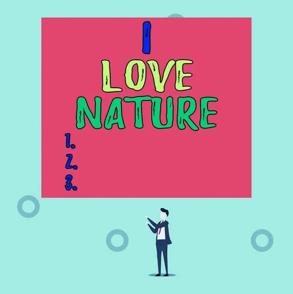 Word writing text I Love Nature. Business concept for Enjoy the natural environment Preservation Protect ecosystem Isolated view young man standing pointing upwards two hands big rectangle. — Stok fotoğraf