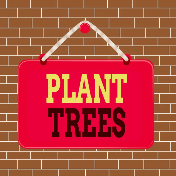 Text sign showing Plant Trees. Conceptual photo process of planting a tree for land cultivation and forestry Board fixed nail frame string striped colored background rectangle panel.