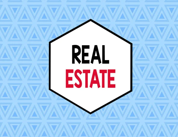 Text sign showing Real Estate. Conceptual photo the property consisting of land and the buildings on it Seamless Pattern of Alternating Straight and Upside Blue Triangles in Line. — Stock Photo, Image