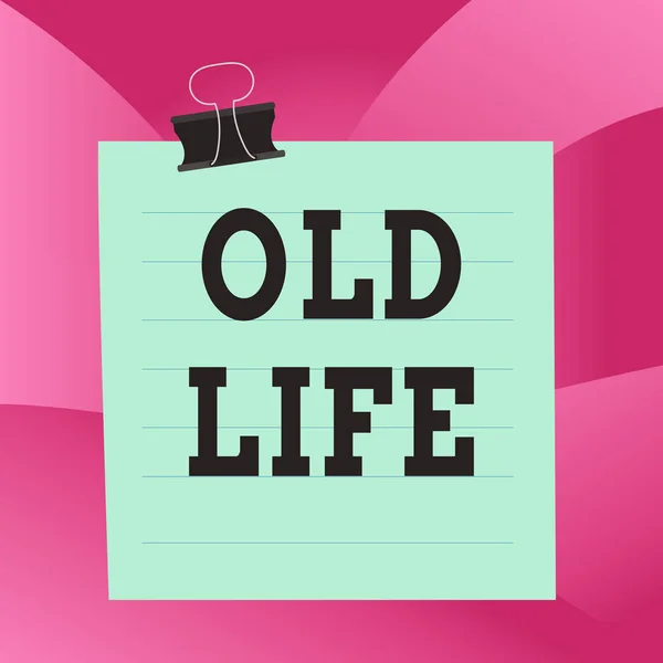 Handwriting text Old Life. Concept meaning the way I was in the past before some important change happened Paper lines binder clip cardboard blank square notebook color background. — Stock Photo, Image