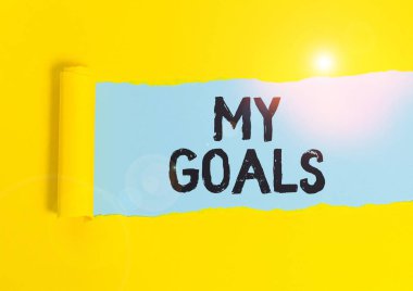 Hedeflerimi gösteren bir not yazıyorum. Geleceği gösteren bir iş fotoğrafı ya da istenen sonuç, bir gösterinin, klasik ahşap bir masanın üzerine yerleştirilen karton kaplamayı başarmak için işlediği suçtur..