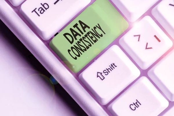 Writing note showing Data Consistency. Business photo showcasing data values are the same for all instances of application. — Stok fotoğraf