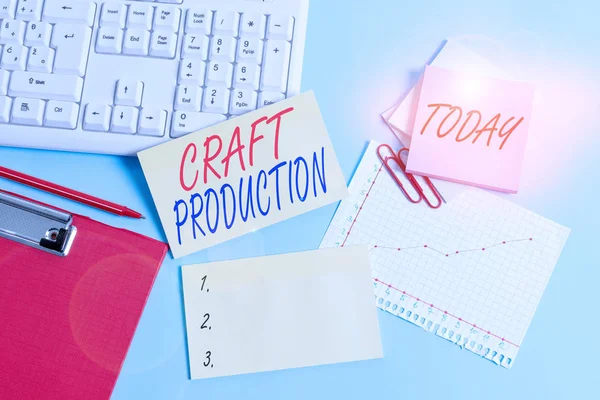 Text sign showing Craft Production. Conceptual photo process of analysisufacturing without the aid of tool or by hand Paper blue desk computer keyboard office study notebook chart numbers memo.