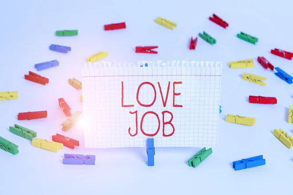 Writing note showing Love Job. Business photo showcasing designed to help locate a fulfilling job that is right for us Colored clothespin papers empty reminder white floor background office.