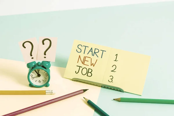 Text sign showing Start New Job. Conceptual photo getting recruited in company Sign fresh work contract Mini size alarm clock beside stationary placed tilted on pastel backdrop.
