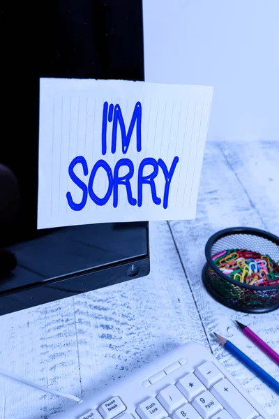 Conceptual hand writing showing I M Sorry. Business photo text To ask for forgiveness to someone you unintensionaly hurt Note paper taped to black screen near keyboard stationary. — Zdjęcie stockowe