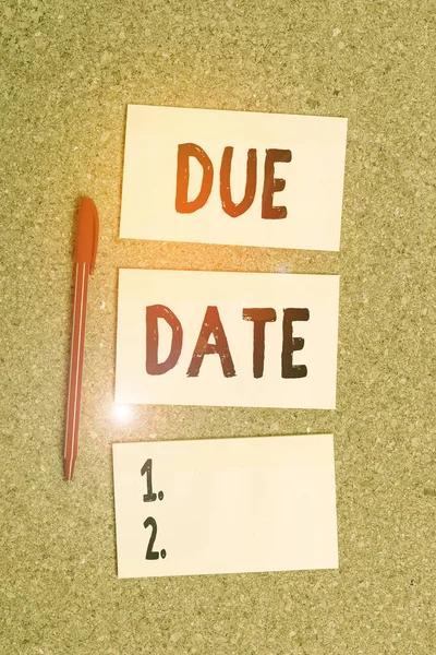 Conceptual hand writing showing Due Date. Business photo showcasing The date when payment should be received by the demonstrating or company Empty sticker reminder memo billboard corkboard desk paper. — Stok fotoğraf