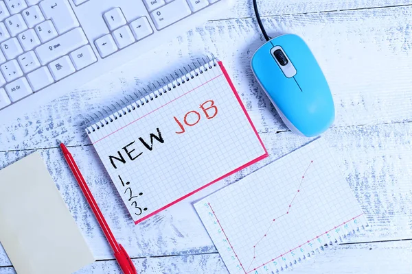 Handwriting text New Job. Concept meaning able to get regular work in order to earn money and support life Writing equipments and computer stuffs placed above classic wooden table. — Stockfoto