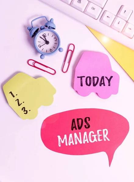 Writing note showing Ads Analysisager. Business photo showcasing oversee and control the various advertising activities Flat lay with copy space on bubble paper clock and paper clips. — Stock Photo, Image