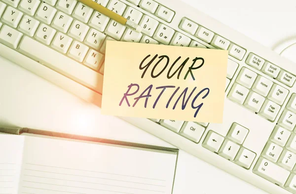 Word writing text Your Rating. Business concept for score or measurement of how good or popular a demonstrating is White pc keyboard with empty note paper and paper clips above white background. — Stok fotoğraf