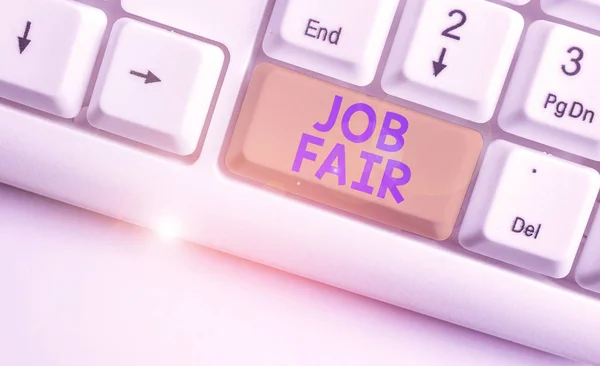 Handwriting text Job Fair. Concept meaning event in which employers recruiters give information to employees White pc keyboard with empty note paper above white background key copy space.