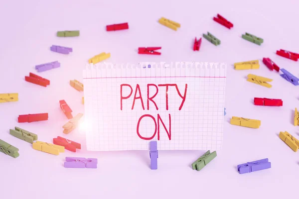 Writing note showing Party On. Business photo showcasing Keep or continue having a great time even after something happens Colored clothespin papers empty reminder white floor background office. — Stock Photo, Image