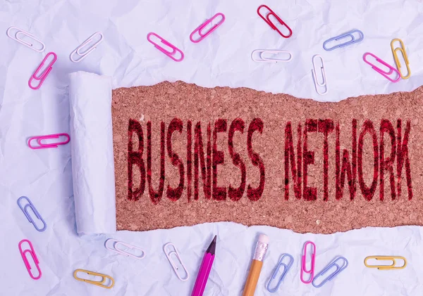 Conceptual hand writing showing Business Network. Business photo text Interfirm cooperation that allows companies to collaborate Stationary and torn cardboard on a wooden classic table backdrop.