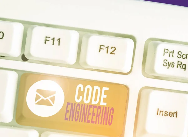 Writing note showing Code Engineering. Business photo showcasing application of engineering to the development of software.