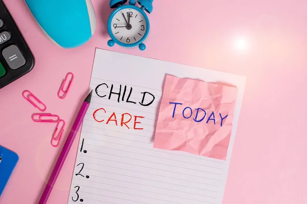 Text sign showing Child Care. Conceptual photo a care of children especially as a service while parents at work Calculator clips clock clipboard mouse sheet note pencil color background. — Stock Photo, Image