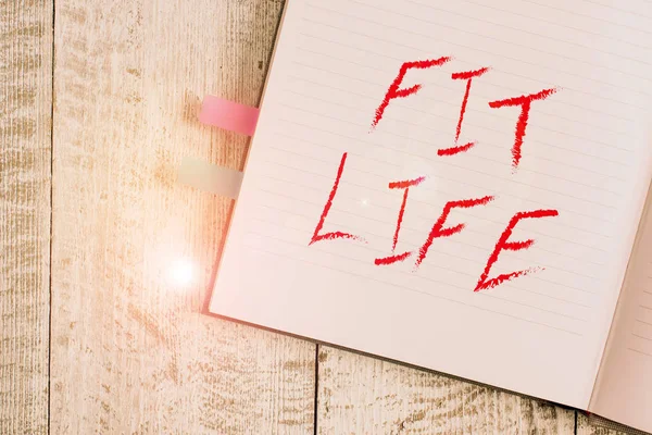 Scrivere una nota che mostra Fit Life. Business foto vetrina mantenendo un peso sano con la dieta e l'esercizio fisico sano Quaderno stazionario posizionato sopra il classico sfondo di legno . — Foto Stock