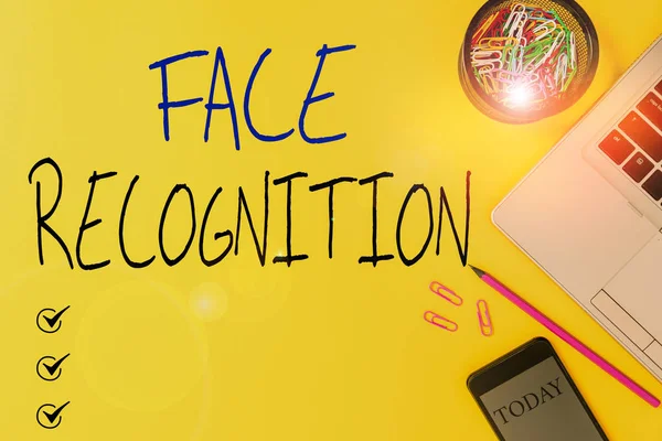 Text sign showing Face Recognition. Conceptual photo ability of a computer to scan and recognize huanalysis faces Slim trendy laptop pencil smartphone clips container colored background. — 图库照片