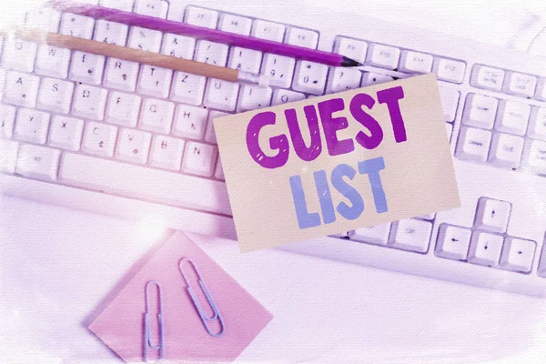 Conceptual hand writing showing Guest List. Business photo showcasing a list of showing who are allowed to enter the show or an event White keyboard with note paper and clips on white background.