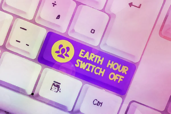 手書きテキスト書き込み｜Earth Hour Switch Off.コンセプト意味ライトアウトイベント年次運動惑星日白い背景キーコピースペースの上に空のノートパソコンキーボード. — ストック写真