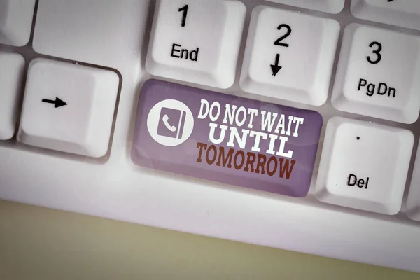 Writing note showing Do Not Wait Until Tomorrow. Business photo showcasing needed to do it right away Urgent Better do now White pc keyboard with note paper above the white background.