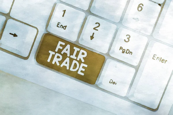 Word writing text Fair Trade. Business concept for buying goods directly from producers in developing countries White pc keyboard with empty note paper above white background key copy space. — Stock Photo, Image