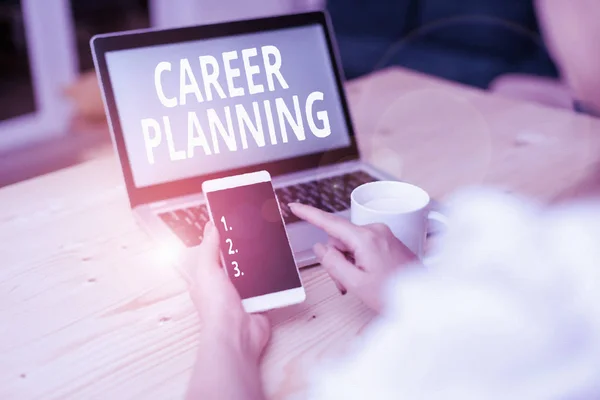 Text sign showing Career Planning. Conceptual photo Strategically plan your career goals and work success woman laptop computer smartphone mug office supplies technological devices.