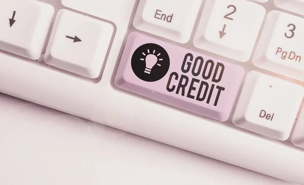 Text sign showing Good Credit. Conceptual photo borrower has a relatively high credit score and safe credit risk White pc keyboard with empty note paper above white background key copy space.