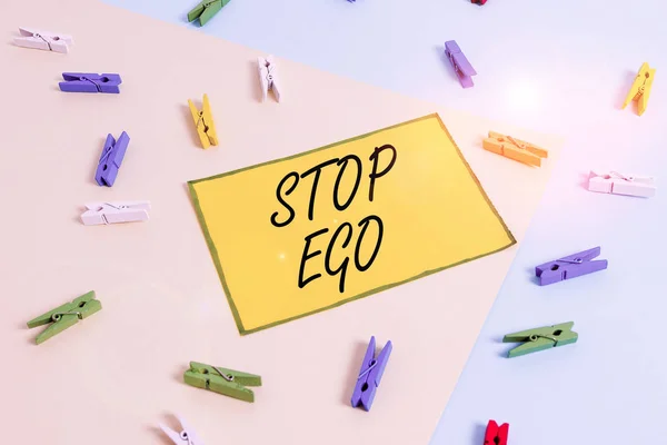 Word writing text Stop Ego. Business concept for Control your obsession about a decision or an event or anything Colored clothespin paper empty reminder yellow blue floor background office. — ストック写真