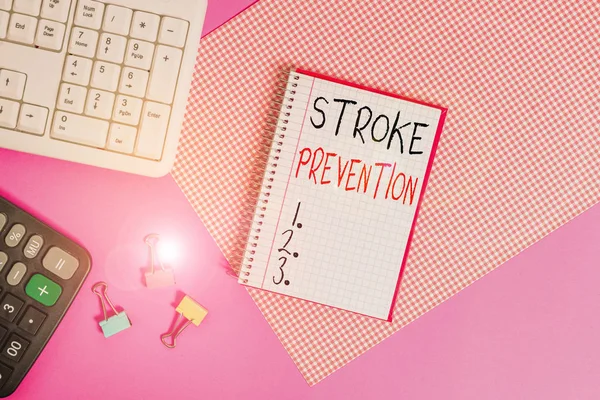 Handwriting text Stroke Prevention. Concept meaning identified demonstratingal risk factors and change lifestyle Writing equipments and computer stuffs placed above colored plain table. — Stockfoto