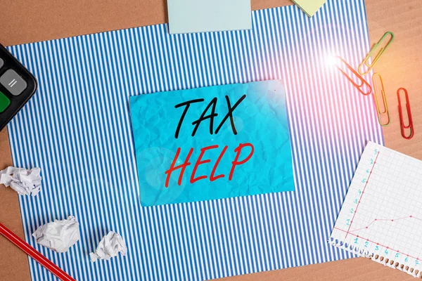 Handwriting text Tax Help. Concept meaning Assistance from the compulsory contribution to the state revenue Striped paperboard notebook cardboard office study supplies chart paper. — Stock Photo, Image