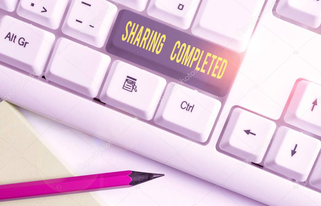 Conceptual hand writing showing Sharing Completed. Business photo text to bring to an end and especially into a perfected state White pc keyboard with note paper above the white background.