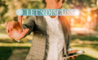 Handwriting text writing Let S Discuss. Concept meaning asking someone to talk about something with demonstrating or showing Business woman in the nature pointing with the finger into empty space.