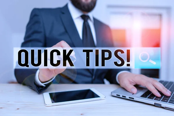 Word writing text Quick Tips. Business concept for small but particularly useful piece of practical advice Male human wear formal clothes present presentation use hi tech smartphone. — Stock Photo, Image