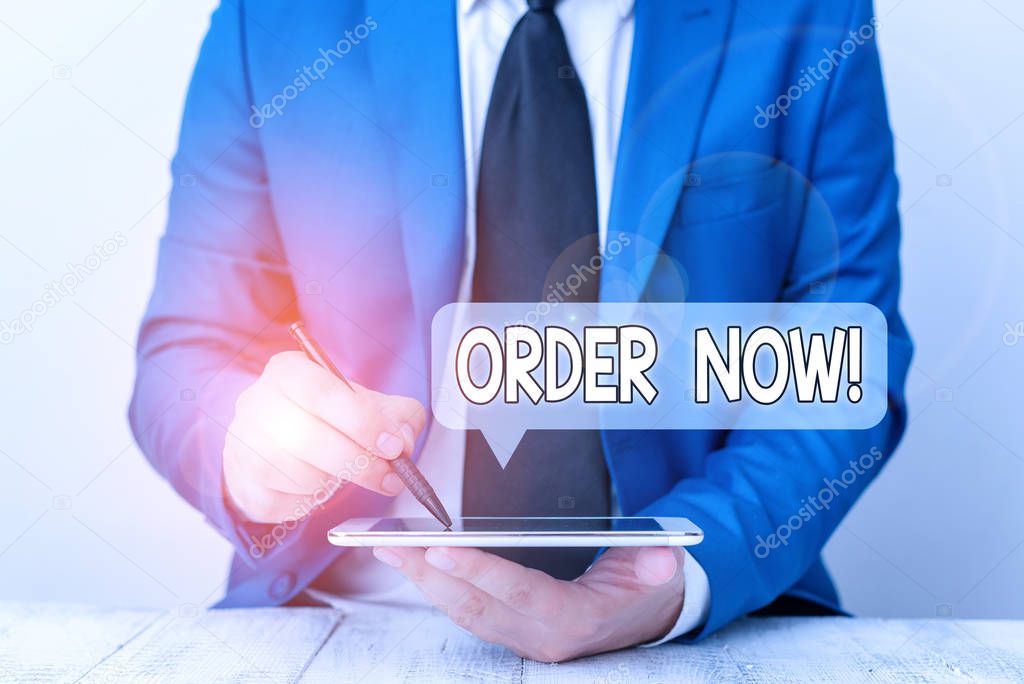 Text sign showing Order Now. Conceptual photo confirmed request by one party to another to buy sell Businessman pointing with pen in empty copy space.
