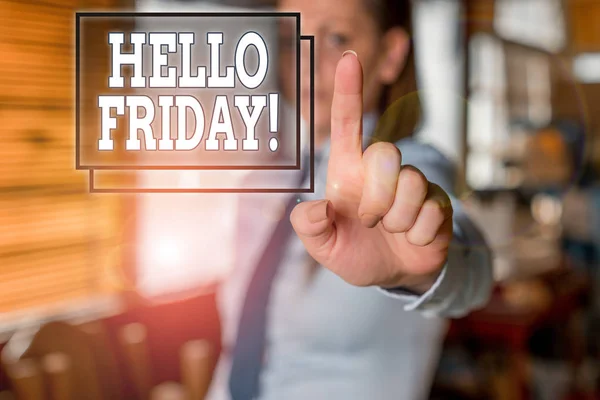 Writing note showing Hello Friday. Business photo showcasing used to express happiness from beginning of fresh week Blurred woman in the background pointing with finger in empty space.