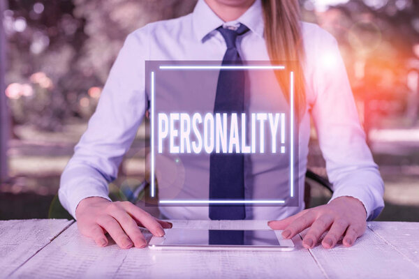 Text sign showing Personality. Conceptual photo combination characteristics that form individuals character Female business person sitting by table and holding mobile phone.