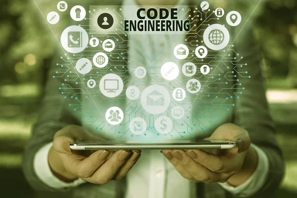 Handwriting text Code Engineering. Concept meaning application of engineering to the development of software.
