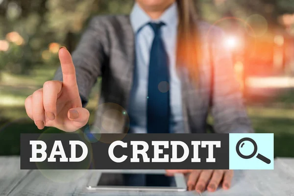 Text sign showing Bad Credit. Conceptual photo inability of a demonstrating or company to repay a debt on time Female business person sitting by table holding mobile phone. — Stock Photo, Image