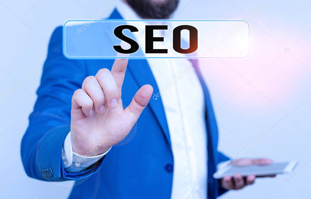 Conceptual hand writing showing Seo. Business photo text incredibly effective way to market your near business online Businessman with pointing finger in front of him.