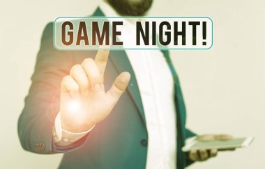 Conceptual hand writing showing Game Night. Business photo text usually its called on adult play dates like poker with friends Businessman with pointing finger in front of him.