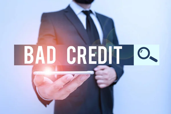Handwriting text Bad Credit. Concept meaning inability of a demonstrating or company to repay a debt on time Male human wear formal work suit hold smart hi tech smartphone use one hand. — Stock Photo, Image