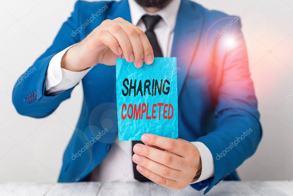 Conceptual hand writing showing Sharing Completed. Business photo showcasing to bring to an end and especially into a perfected state Man holds empty paper with copy space in front of him Space.