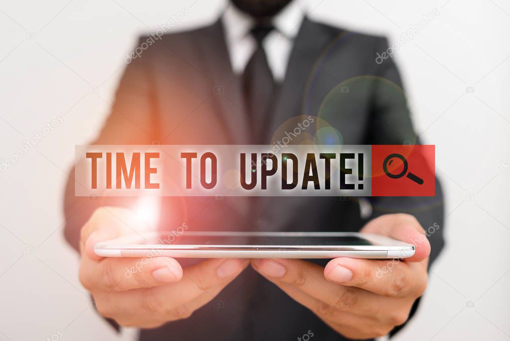 Text sign showing Time To Update. Conceptual photo act updating something someone or updated version program Male human wear formal work suit hold smart hi tech smartphone use hands.