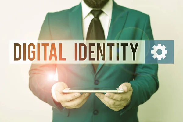 Text sign showing Digital Identity. Conceptual photo networked identity adopted or claimed in cyberspace Businessman in blue suite with a tie holds lap top in hands.