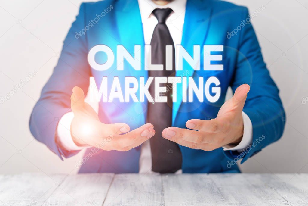 Conceptual hand writing showing Online Marketing. Business photo showcasing promoting products and services through the internet Man holds empty paper with copy space in front of him Space.