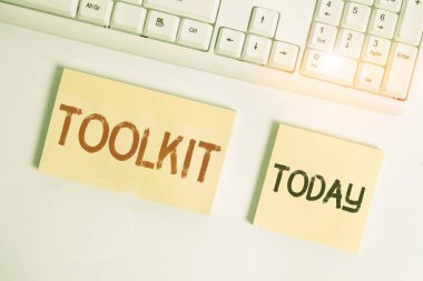 Text sign showing Toolkit. Conceptual photo set of tools kept in a bag or box and used for a particular purpose Flat lay above blank copy space sticky notes with business concept. clipart