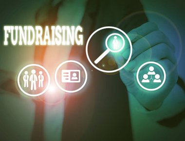 Bağış topladığını gösteren kavramsal el yazısı. Belirli bir amaç için para toplamak veya üretmek için iş fotoğrafı eylemi.